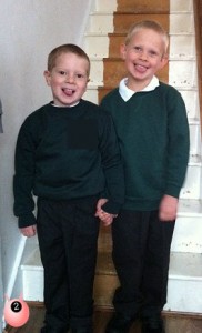 Two cheeky boys on their first day of school